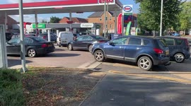 Long queues at some UK petrol stations as drivers defy appeals not to panic buy