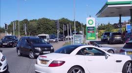 Cars, motorhomes and lorries queue at BP Garage in Kent, UK
