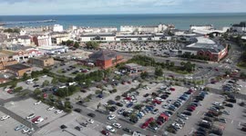 4K aerial footage: cars queue to panic buy fuel and block exits at Asda Llandudno