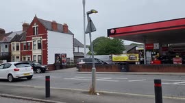 Cars queuing at petrol station near Cardiff