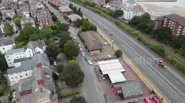 Aerial footage of Welsh drivers blocking traffic as they queue along the road for petrol
