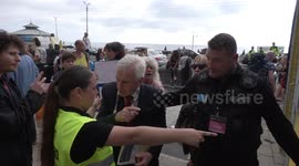 Piers Corbyn and other anti-vaccine protesters CHASE MP John McDonnell outside Labour Party Conference