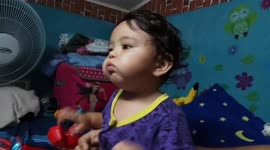 Cute little baby reaction while watching a small cat in nursery rhymes