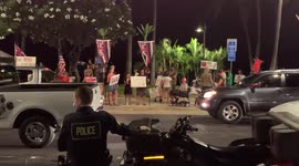 Anti vaccine protesters in Waikiki, hawaii. Police keeping people in check. Protesters block Waikiki in hawaii