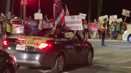 Anti vaccine protesters in hawaii - police keeping protestors under control - roads blocked in Waikiki hawaii