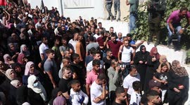 Mourners carry the body of Osama Sobh, a Palestinian man killed by Israeli soldiers during clashes near Jenin