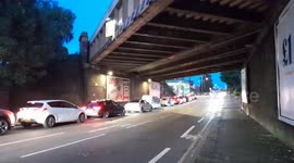 Dozens of vehicles form queue on busy road at petrol station in London's New Malden on Sunday night
