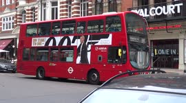 'No Time To Die' advertising displayed on a London double-decker bus - Sloane Square