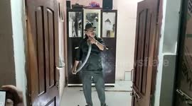 Snake catcher captures large cobra that entered resident's home in central India