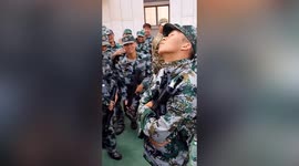 University freshman falls asleep while standing up during military training in China