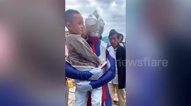 Boy scared by father dressed up as Japanese superhero when picking him up from kindergarten