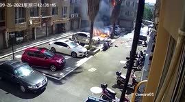 Fire caused by exploding firecrackers burns tree and car in Chinese residential community