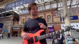 Michael Sebastian Entertains Waiting Commuters in Victoria Station. Busking in London is An Initiative of The Major Of London Sadiq Khan.