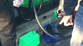 Motorists in Boris Johnson’s constituency get into heated conversation while filling jerry cans with fuel