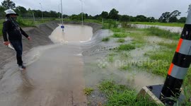 Villagers fish in flooded railway underpass in Thailand