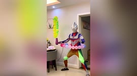 Chinese dad dressed as Japanese superhero performs balloon tricks to surprise son