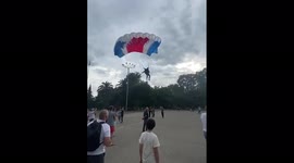 Russian paratrooper lands on SPECTATOR during display