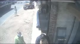 Elderly man escapes injury after out of control truck crashes down pavement in India