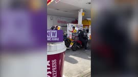 UK petrol station worker shouts at moped driver for trying to jumping queue