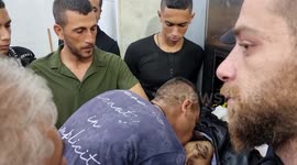 Palestinians mourn by the body of Alaa Zyoud repotedly killed in clashes with Israeli forces in Burqin village