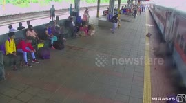 Elderly woman falls while deboarding train, rescued in western India