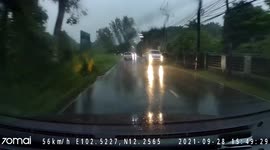 Driver records lightning hitting electricity pole during Thailand storm