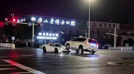Distracted motorist ends up driving onto Ferrari on highway in northern China