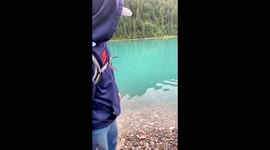 Skipping rocks at Avalanche Lake in Glacier National Park, skipping rocks