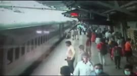 Indian security personnel rescue a man when he fell  while giving bag to his uncle in Western India.