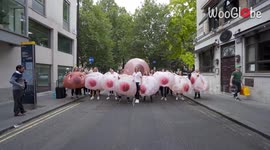 'Nipple tattooists in inflatable breast costumes protest outside Facebook HQ over its policy on nudity 
'