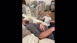 Cutest alarm clock ever? Toddler gently wakes sleeping dad in most adorable way