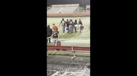 High school football players dump ice-cold water on coach following BIG WIN