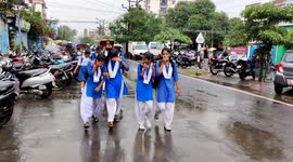Indian School girl's enjoy rainy weather in street