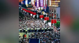 Police officers form human barrier to direct traffic during China's National Day holiday