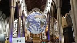 Luke Jerram's stunning installation Gaia a replica of earth is displayed in a beautiful Norwich medieval church