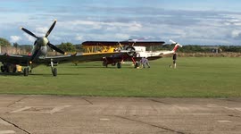 Stuntmen take off in two vintage biplanes filming Mission Impossible Part Two: Taking off