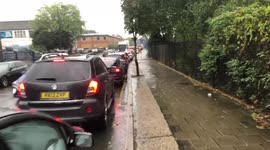 Endless queue for petrol station in Ealing, London, as city has