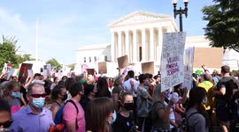 Women's March passes Supreme Court as riot police stand between marchers and anti-abortion protesters