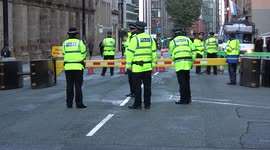 Armed police patrol Manchester city centre on day one of the Conservative Party Conference