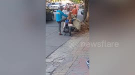 Obedient puppy rides on motorcycle with owner