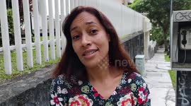 People react as Venezuela slash six zeroes from its inflation-battered currency in Caracas, Venezuela