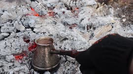 The forest, the birds are singing. I brew coffee at Cezve over the fire.