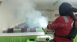 Indonesia Still On The Red List Of Covid-19 Cases, Indonesian volunteers do the spraying disinfection COVID-19 to Save Student