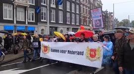 Netherlands: Thousands Protest Against COVID-19 Measures In Amsterdam 5