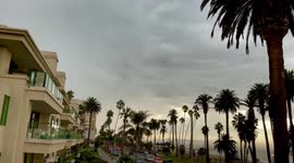Rolling Thunder, Lightning, and Rain over Los Angeles Beaches. Life Guards rush beach goers off the sand and piers.
