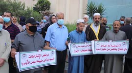 Palestinians take part in a protest against the United States and UNRWA signing a Framework for Cooperation