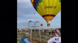 Hot-air Balloon landing during Balloon Fiesta in Albuquerque, US