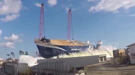 'Ruuunnn!' Spectators flee as US ship launch sends huge wave crashing towards them