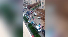 Wall collapses damaging vehicles parked under it in Chinese residential community