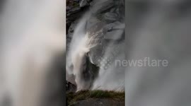Watch the moment waterfall flows BACKWARDS in the Peak District, UK